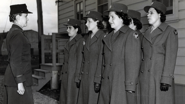 Women’s Army Corps soldiers standing at attention in a photo from Charlotte Mansfield’s World War II scrapbooks. Courtesy of the Florida State University Institute on World War II and the Human Experience.